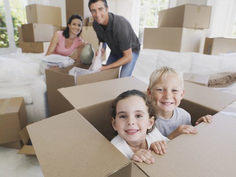 Removal team pricing a move in Shoreditch with packed boxes and furniture