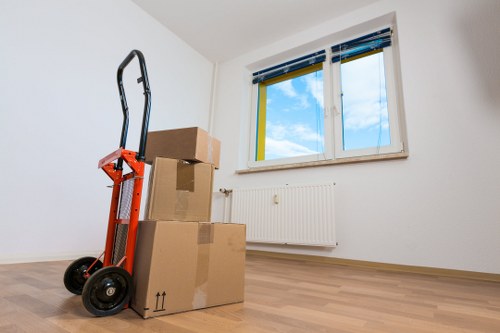 Large sofa and wardrobe being moved during Shoreditch furniture removals